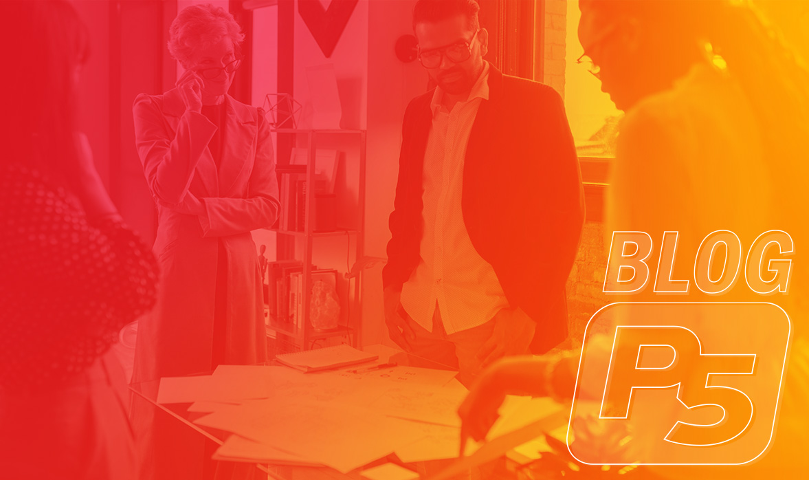 Media buyer analyzing campaign performance across multiple screens